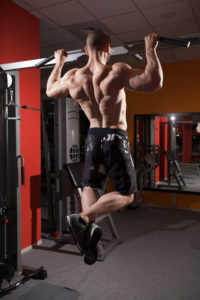 Want to build a big, powerful back like this? Pull ups are the key.